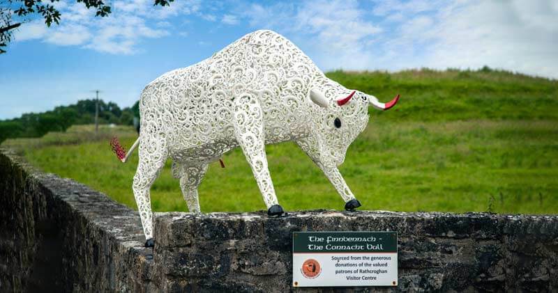 A metal bull figurine in front of rathcroghan Visitors centre