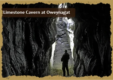 Interior of a limestone cavern at Rathcroghan, featuring natural rock formations and textured stone walls